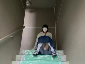 Mayu Konka shows off her pantyhose in the stairs of her apartment building.