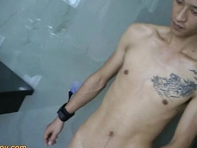 Young Asian boy with a big cock pleases himself while in bondage