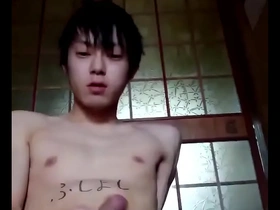 Young Japanese gay man masturbates.