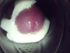 Gay man enjoys solo pleasure with a Fleshlight and ejaculates inside it.