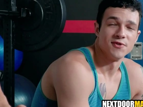 Muscular hunk gets some hot gay action in the gym.