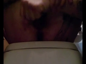 Gay man pleasuring himself by licking his own cock.