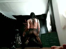 Gay ladyboy prostitute in stockings and heels.
