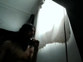 A bearded ladyboy enjoys 12 minutes of deepthroating a dildo.