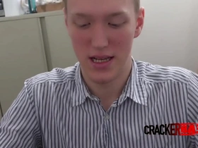 Young gay redhead gives blowjob to a black man
