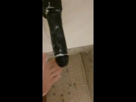 Public shower pleasure with a big toy in the gym