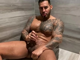 A tattooed and muscular bear of a man gives you a steamy shower experience.