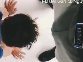Young Asian man gives oral sex to his dominant master