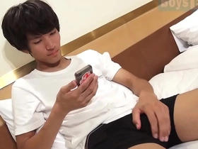 Suzuki Socks, a hot soccer player with a big cock, masturbates in a hotel room.