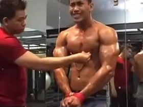 Gay Asian gym top’s nipple tease