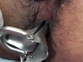 Young Asian man gets his ass teased with a sex toy by a doctor in a medical uniform.