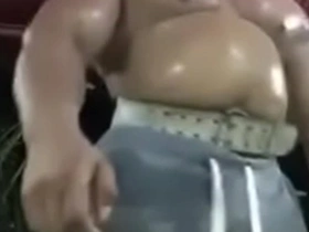 A thick and muscular Thai man shows off his physique in the gym.