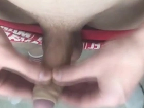 The crimson-clad lad indulges in self-pleasure, vocalizing his intense satisfaction