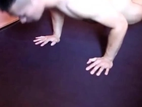Fit Asian man shows off his muscles