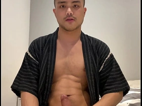Asian boy in Jinbei stroking